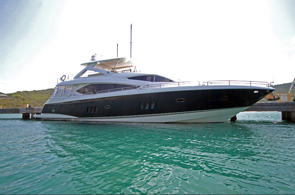 Custom boat wrap in Miami showing vibrant design on luxury yacht