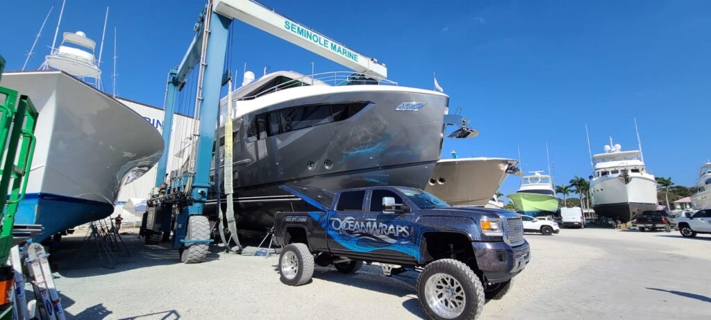 Professional installing boat wraps in Miami
